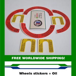 May include: A collection of red and yellow wheel stickers and a Castrol Formula SLX 0W-30 oil container. The stickers have text in German and English, with instructions for tire mounting and balancing. The oil container is white and green.