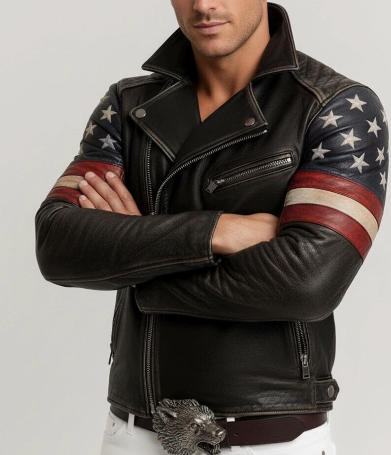 May include: Black leather jacket with a classic asymmetrical zip design. The sleeves feature a patriotic design with white stars on a blue background and red and white stripes. The jacket has a silver wolf buckle.