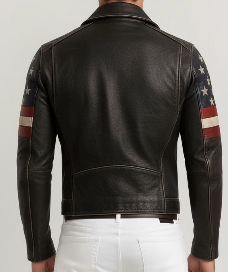 May include: Black leather jacket with American flag design on the sleeves. The jacket features a classic biker style with a notched collar, zipper closure, and a tailored fit. The sleeves display a pattern of white stars and red and white stripes.