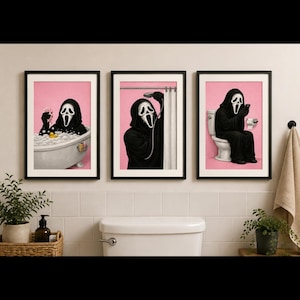 May include: A set of three framed wall art prints featuring the Ghostface character in a bathroom setting. The first shows the figure in a bubble bath, the second showering, and the third sitting on a toilet using a smartphone, all on pink backgrounds.