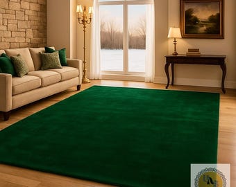 May include: A large, rectangular emerald green rug dominates the foreground of a living room scene. The rug sits on a light-colored hardwood floor, complementing the neutral tones of the sofa and brick wall. A window offers a view of a snowy landscape.