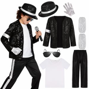 May include: A performance costume set including a black sequined jacket with silver sleeve bands, a white v-neck t-shirt, black trousers with silver side stripes, a black sequined fedora, a silver sequined glove, aviator sunglasses, and a microphone.