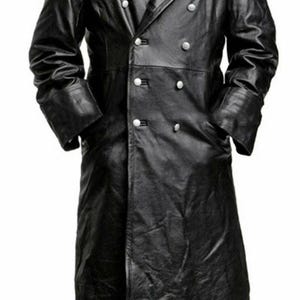 May include: A long, black leather coat with a double-breasted design. The coat features a notched collar, multiple silver buttons, and pockets. The sleeves have turned-up cuffs. The coat is a classic style.
