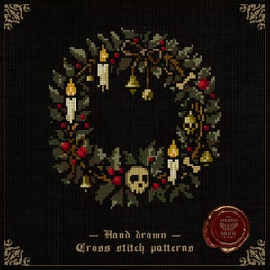 May include: Cross-stitch pattern of a wreath featuring candles, berries, and a skull. The wreath is adorned with green leaves, red berries, gold bells, and bone details. Text reads "Hand drawn Cross stitch patterns".