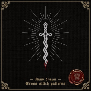 May include: A cross-stitch pattern of a dagger with a wavy blade, radiating lines, and a blood-red tip, set against a black background. The text reads "Hand drawn Cross stitch patterns". A circular seal with the text "The Gilded Moth" is in the lower right corner.