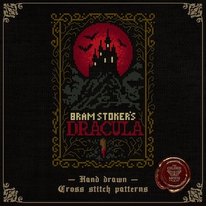 May include: Cross-stitch pattern depicting a castle silhouette against a red moon, with bats in flight. The text "Bram Stoker's Dracula" is in red. The design is framed with a gold border and the text "Hand drawn - Cross stitch patterns".