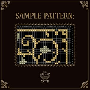 May include: A cross-stitch pattern design with the text "SAMPLE PATTERN:" at the top. The design features a grid with gold and white elements, including stars and stylized shapes. The bottom of the image displays "THE GILDED MOTH" and a moth illustration.