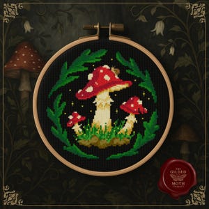 May include: Cross-stitch embroidery of red and white mushrooms with green leaves, set against a black background. The design is framed in a wooden hoop, showcasing a whimsical, nature-inspired theme. The artwork is detailed and colorful.