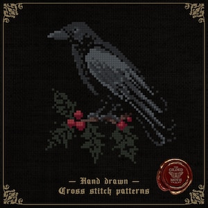 May include: Cross-stitch pattern of a crow perched on a branch with red berries and green leaves. The crow is gray and black, set against a black background. Text reads "Hand drawn Cross stitch patterns". A red seal is in the lower right corner.