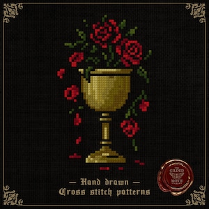 May include: Cross-stitch design featuring a golden chalice filled with red roses and green foliage, on a black backdrop. The text reads "Hand drawn Cross stitch patterns". A red wax seal with "The Gilded Moth" is in the bottom right corner.