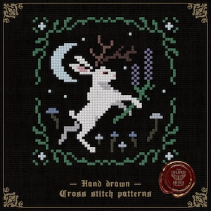 May include: Cross-stitch design of a white rabbit with antlers leaping towards a crescent moon, surrounded by green vines and purple flowers. The text "Hand drawn Cross stitch patterns" is on a black background.