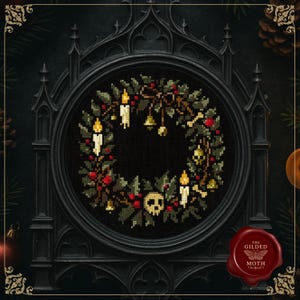 May include: A cross-stitch wreath featuring candles, berries, and a skull, presented in a black gothic frame. The circular wreath has a dark background and detailed stitching. The frame has ornate details, and a red wax seal is visible.