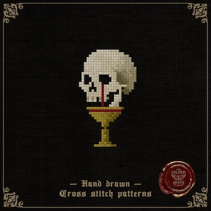 Op de afbeelding: Kruissteekpatroon met een schedel met rode vloeistof die uit de oogkassen druppelt, rustend op een gouden kelk. Het ontwerp staat tegen een zwarte achtergrond met de tekst "Hand drawn Cross stitch patterns". Een rood zegel met "The Gilded Moth" is ook aanwezig.