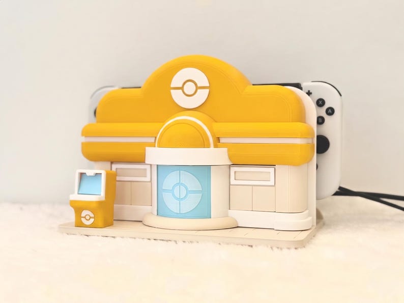 Whimsical Theme Pokopia Poke Center Nintendo Switch 1 or 2 Dock | Multiple or Personalised Colours Available | 3D Printed Gift Yellow