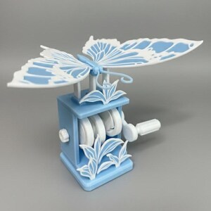 Flapping Dancing Butterfly Wings Hand-Crank Fidget Toy – Interactive Nature 3D Printed Decor Baby Blue and White