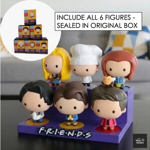 May include: A set of six Friends character figurines displayed on a purple base with the show's logo. The figures are in a cartoon style, each with unique outfits and hairstyles. The text "INCLUDE ALL 6 FIGURES - SEALED IN ORIGINAL BOX" is visible.