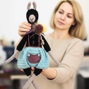 Black Llama Amigurumi Pattern with Blue Shorts, Purple Fabric Pocket & Pompom Scarf – Movable Limbs