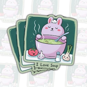 May include: A stack of square stickers featuring a cartoon bunny chef with a bowl of soup. The bunny is pink, and the soup is green. Other illustrations include a tomato, garlic, salt shaker, and green onions. The text "I Love Soup" is at the bottom.
