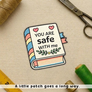 May include: A set of three ceramic mugs with a speckled, matte finish. Each mug features a different color: light blue, cream, and gray. The mugs have a simple, modern design and a comfortable handle.