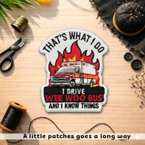 May include: Embroidered patch with the text "THAT'S WHAT I DO I DRIVE WEE WOO BUS AND I KNOW THINGS." The patch features a red and white ambulance design with flames. The phrase "A little patches goes a long way" is at the bottom.