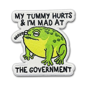 May include: A rustic wooden sign with the text "Welcome to our home" in white lettering. The sign features a distressed finish and a simple, inviting design, perfect for a front porch or entryway.