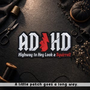 May include: Embroidered patch with the text "AD HD" in a gothic font, featuring a red squirrel and lightning bolt design. The phrase "Highway to Hey Look a Squirrel!" is below. The patch is on a black background. The text "A little patch goes a long way." is at the bottom.