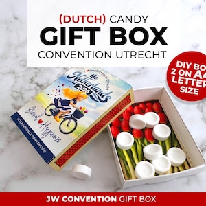 May include: A Dutch candy gift box with a lid featuring a cartoon of a person on a bicycle and the text The Netherlands 2026. The open box contains white round candies arranged over a printed image of red tulips. Includes text DIY BOX 2 ON A4 LETTER SIZE.