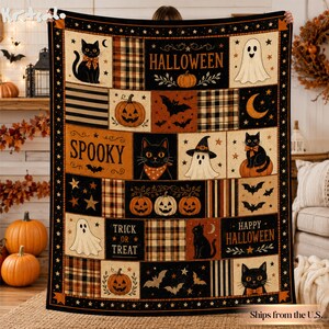 May include: A rectangular Halloween-themed throw blanket featuring a patchwork design of black cats, pumpkins, ghosts, bats, and plaid patterns. The text includes HALLOWEEN, SPOOKY, TRICK OR TREAT, and HAPPY HALLOWEEN in a bold, decorative font.