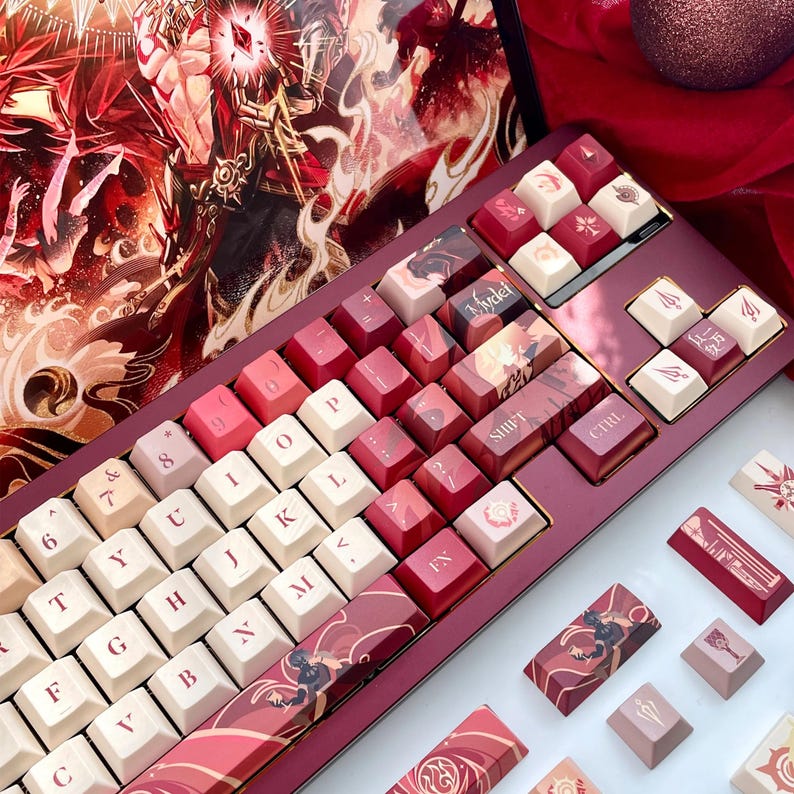 May include: A custom mechanical keyboard with a burgundy case and keycaps in shades of red, white, and pink. Some keycaps feature illustrations. The keyboard is surrounded by additional keycaps and a decorative background.