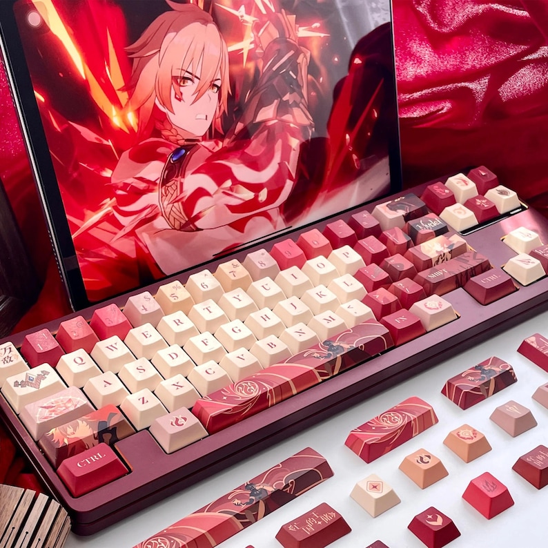May include: A mechanical keyboard with red and cream-colored keycaps. The keyboard has a burgundy frame and features custom keycaps with Japanese-inspired designs. A tablet displaying anime art is in the background.