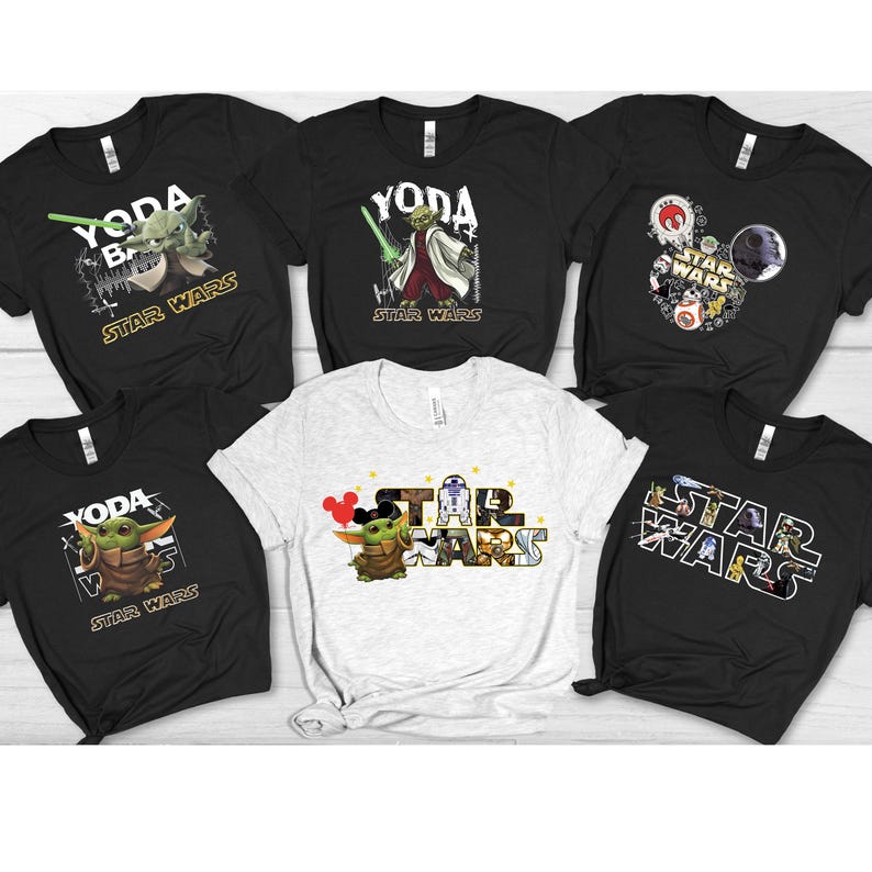 Group of black and white t-shirts featuring Star Wars DTF heat transfer designs, including Baby Yoda, Darth Vader, and Star Wars logos applied on fabric."