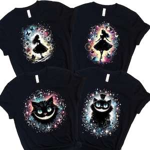 May include: Four black t-shirts with designs inspired by Alice in Wonderland. The designs include a silhouette of Alice, a Cheshire Cat with a wide grin, and other whimsical elements. The designs are surrounded by colourful, sparkling accents.