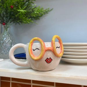 3D Orange Glasses Face Mug, Whimsical Ceramic Coffee Cup, Quirky Eyewear Pottery, Retro Art