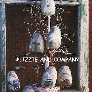 May include: A collection of painted Easter eggs with various spring-themed designs, including a bunny, a bird, and the words "Happy Easter" and "He is Risen". The eggs are hanging from a white wire tree and are displayed in a wicker basket.