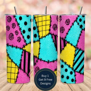 May include: Three glittery stainless steel tumblers with a patchwork design in pink, teal, yellow, and black. The design includes spirals, dots, and stripes, with a stitched effect. Each tumbler has a silver lid and a straw. The text on the image says "Buy 1 Get 9 Free Designs."