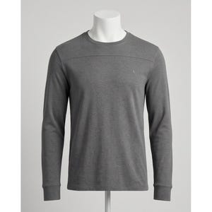 May include: A charcoal gray long-sleeve shirt featuring a crew neckline and a horizontal seam detail across the upper chest. The garment has a solid color finish with a small, subtle embroidered logo on the left side of the chest area.