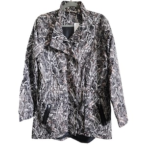 May include: A long, snake-print jacket in shades of black, white, and brown. The jacket features a stand-up collar, a zipper closure, and two front pockets. The jacket is hanging on a gray hanger.
