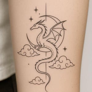 May include: A black line art tattoo design of a dragon on a crescent moon, with clouds and stars. The dragon has detailed wings and a long tail. The design is simple and elegant, suitable for body art.