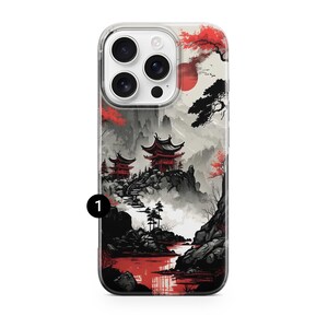 May include: Clear phone case featuring a Japanese landscape design. The artwork depicts red pagodas, trees, and a setting sun against a gray and white mountain backdrop. The case has a black number 1 in the lower left corner.