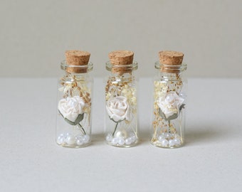 set of  3   paper flowers  and real dried flowers  in mini  glass bottles