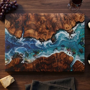 Tempered glass cutting board with flat printed faux ocean epoxy resin and burl wood illusion perfect for coastal charcuterie tray and kitchen decor