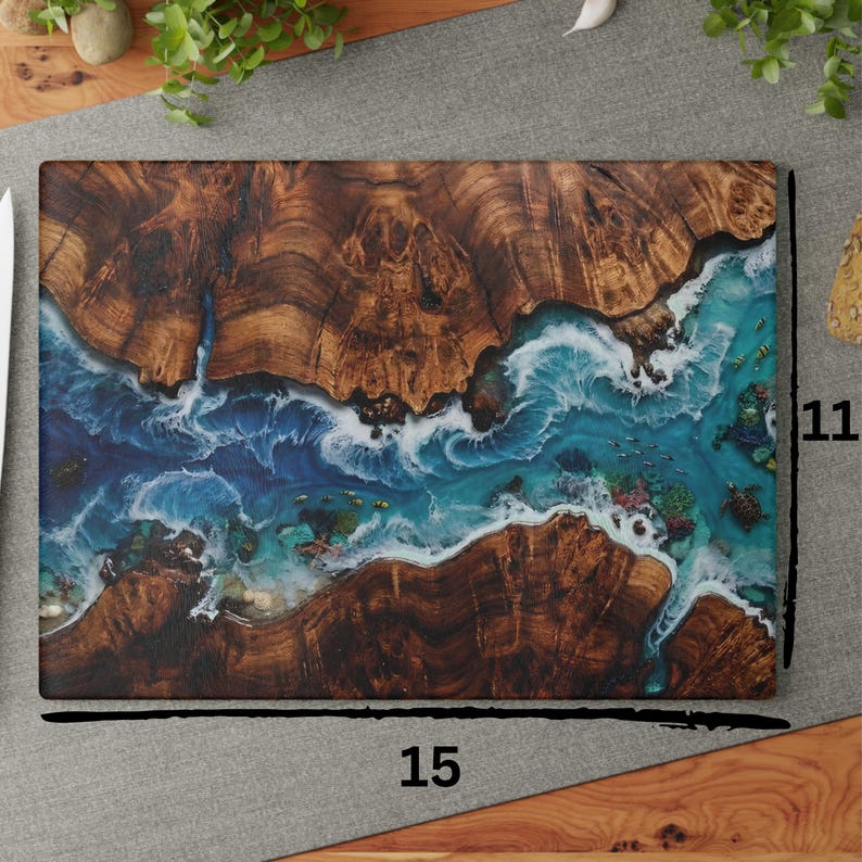 Tempered glass cutting board with flat printed faux ocean epoxy resin and burl wood illusion perfect for coastal charcuterie tray and kitchen decor