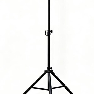 May include: A black tripod stand featuring a central vertical pole with an adjustable locking knob and three collapsible legs. The structure is made of metal and includes a top mounting point for equipment, providing a stable base.