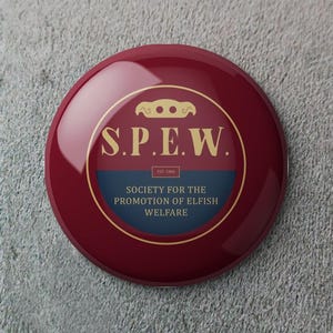 May include: A glossy, circular button with a maroon background. The center features a gold-colored emblem and text that reads "S.P.E.W." above "Society for the Promotion of Elfish Welfare." The button is a promotional item.