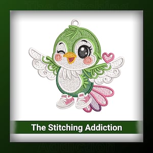 May include: An embroidered design of a winking green bird with white wings, wearing pink sneakers and holding a pink heart. The bird has a yellow beak and a white belly. The text "The Stitching Addiction" is at the bottom.