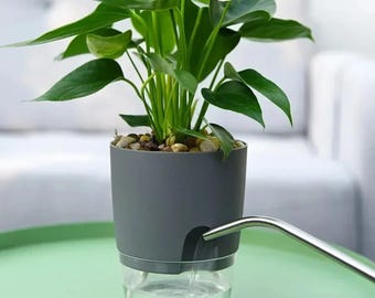 Maceta de plástico de doble capa con autorriego y depósito