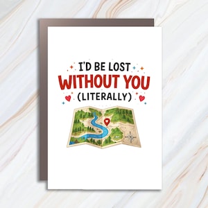 May include: A white greeting card with the text "I'D BE LOST WITHOUT YOU (LITERALLY)" in red and black. Below the text is a map illustration with a red pin. The card is on a brown background.