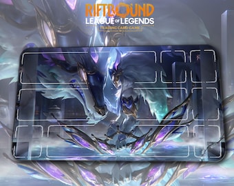 May include: A rectangular playmat for the "Riftbound League of Legends Trading Card Game." The mat features a detailed illustration of a fantasy creature in shades of blue, purple, and white. The game's logo is at the top.