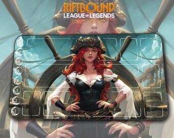 May include: A Riftbound League of Legends trading card game playmat. The mat features a pirate-themed illustration of a woman with red hair, wearing a black and white outfit, and a pirate hat. The background shows a ship's wheel and a stormy sky.