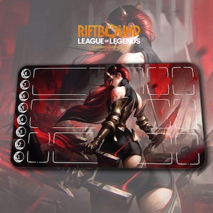 May include: A rectangular playmat featuring a warrior with red hair and gold armor, holding two swords. The mat has a red and black color scheme with the text "RIFTBOUND LEAGUE OF LEGENDS TRADING CARDS" at the top and numbered zones.